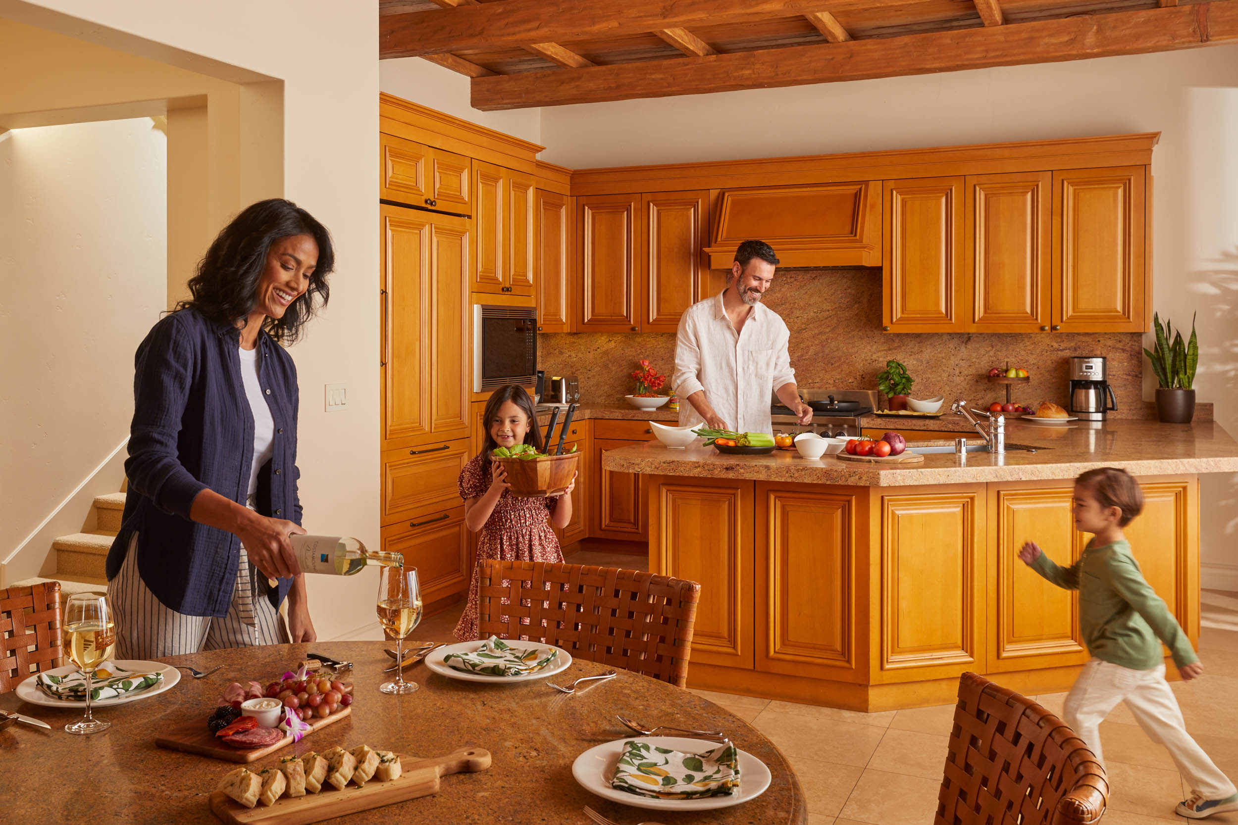 family in villa kitchen