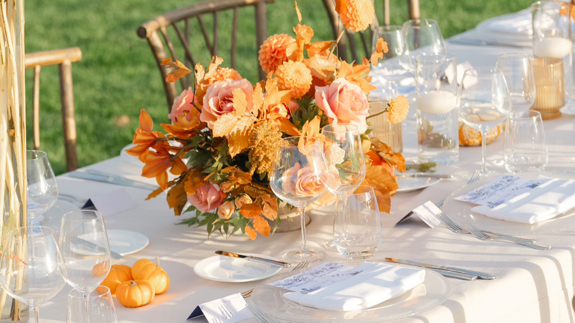 orange yellow floral arrangement dining table